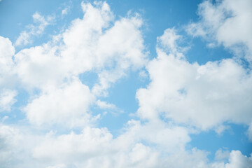Beautiful white cloud with blue sky background.Bright blue sky background with tiny clouds.