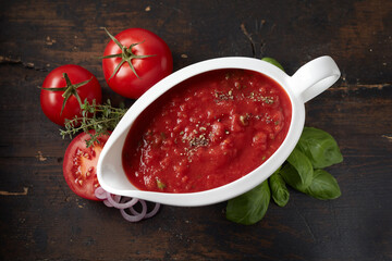 Neapolitan sauce with dry oregano in gravy boat