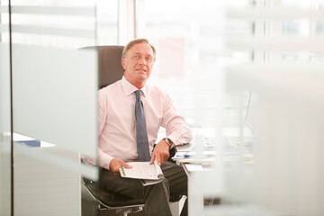 Businessman sitting at desk in office