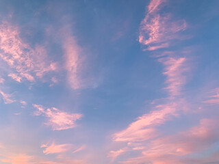 Tender blue sky with some purple clouds background, natural colors