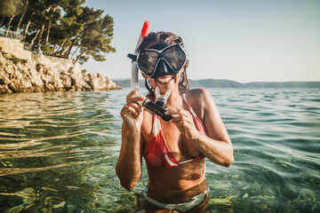 Woman With Scuba Mask In The Sea
