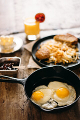 Breakfast fried eggs and hashbrowns