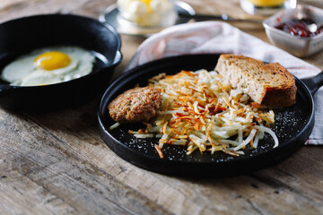 Breakfast fried eggs and hashbrowns