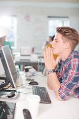 Businessman working at computer at desk