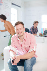 Fototapeta premium Businessman smiling in office