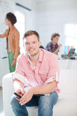 Fototapeta premium Businessman smiling in office