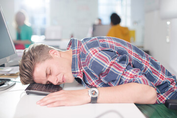 Businessman sleeping at desk