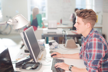 Businessman working at computer at desk