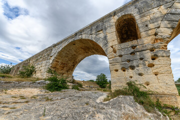 Fototapeta na wymiar The Julien bridge, Roman bridge over the Calavon river. Roman bridge in the Luberon located on the Via Domitia.