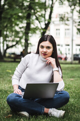 Caucasian Student girl working with a laptop