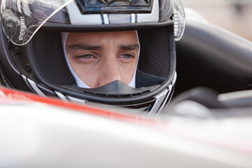 Fototapeta premium Close up of racer wearing helmet
