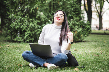 Caucasian Student girl working with a laptop