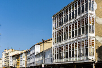 Typical white wooden balconies in Aguilar de Campoo, Palencia, Spain