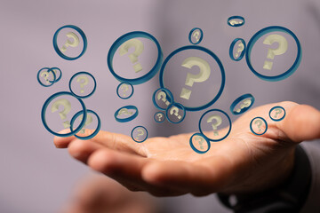 Businessman solving problem with digital question marks 3D rendering