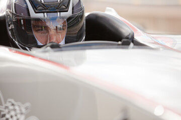Fototapeta premium Close up of racer wearing helmet