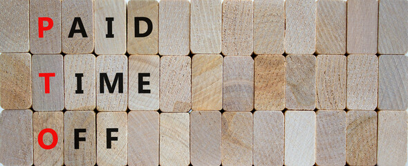 PTO, Paid time off symbol. Wooden blocks with concept words 'PTO, Paid time off'. Beautiful wooden background, copy space. Business and PTO, paid time off concept.