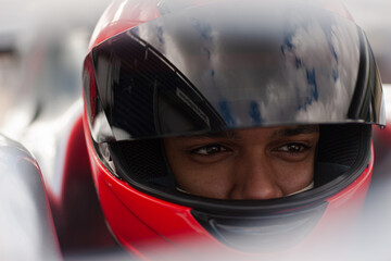 Close up of racer wearing helmet