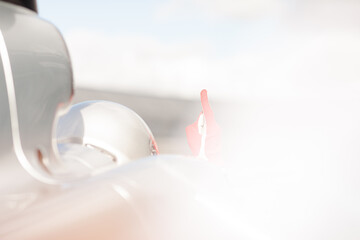 Racer showing sign in car