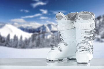 White ski boots on desk and free space for your decoration. 