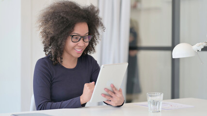 Video Call on Tablet by African Woman at Work 