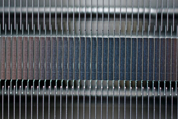 Silver aluminum CPU radiator with copper cooling tubes close-up