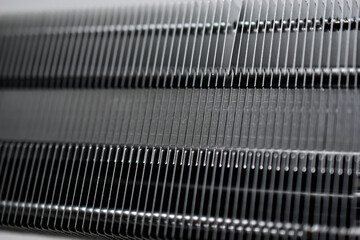 Silver aluminum CPU radiator with copper cooling tubes close-up