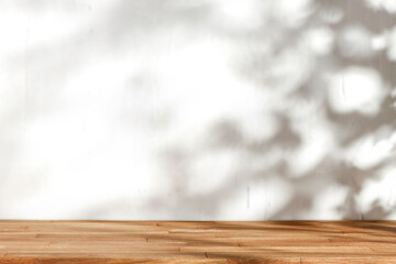 Wooden table with shadow on the wall on a beautiful autumn day 