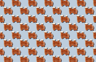 Pattern of gingerbread christmas train cookies on gray background