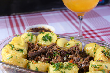 delicious portion of lamb, beef cooked with potatoes and fine herbs