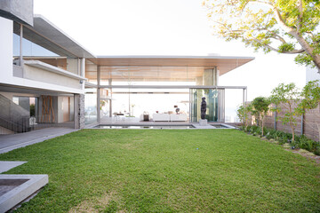 Lawn chairs and swimming pool in backyard
