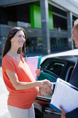 Businesswomen talking on city street