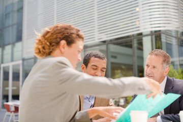 Business people talking outdoors