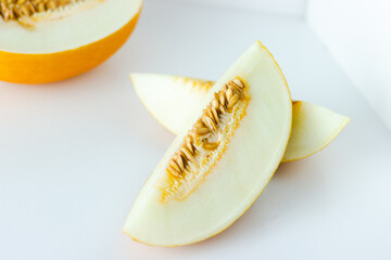 Close up of honeydew melon isolated on white background; summer fruit  