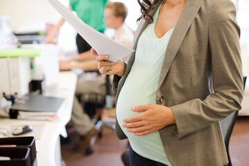 Businesswoman reading document in office