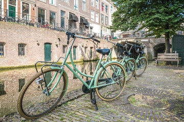 Fototapeta na wymiar Green bikes in Utrecht, Utrecht province, The Netherlands