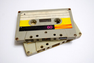 Obraz premium Two audio cassettes on a white background. Old compact cassettes