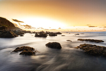 Naklejka premium Sunset at Almaciga beach, silky sea at Almaciga beach, Tenerife, Spain.