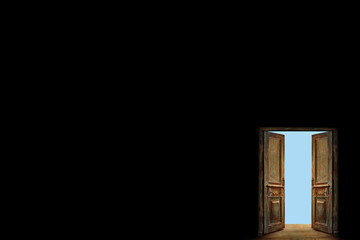 Opened ancient doors on a black wall