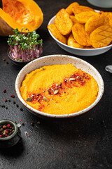 pumpkin cream soup puree fresh portion ready to eat meal snack on the table copy space food background rustic. top view keto or paleo diet veggie vegan or vegetarian food