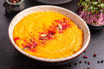 pumpkin cream soup puree fresh portion ready to eat meal snack on the table copy space food background rustic. top view keto or paleo diet veggie vegan or vegetarian food