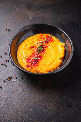 pumpkin cream soup puree fresh portion ready to eat meal snack on the table copy space food background rustic. top view keto or paleo diet veggie vegan or vegetarian food