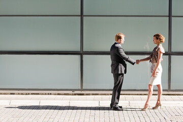 Fototapeta na wymiar Business people shaking hands outdoors