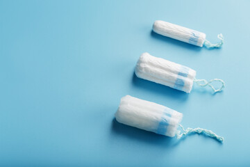 Gynecological tampons on a blue background free space
