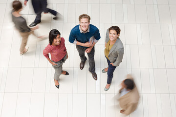 Business people in busy office hallway