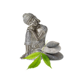 Old silver color statuette  sleeping Buddha with zen stones and cannabis leaf isolated on white background