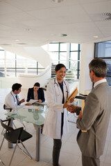 Portrait of serious doctor in hospital corridor