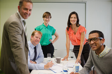 Business people smiling in meeting