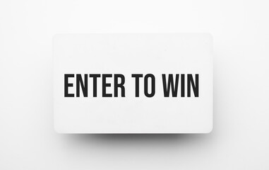 Enter to Win sign on notepad on the white backgound