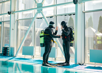 Male diver and divemaster in scuba gear, diving © Nomad_Soul