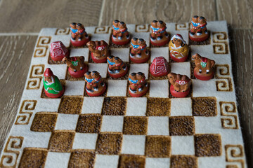 multicolored chess stand on a cloth board